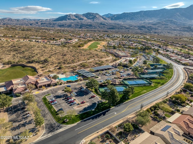 birds eye view of property with a mountain view