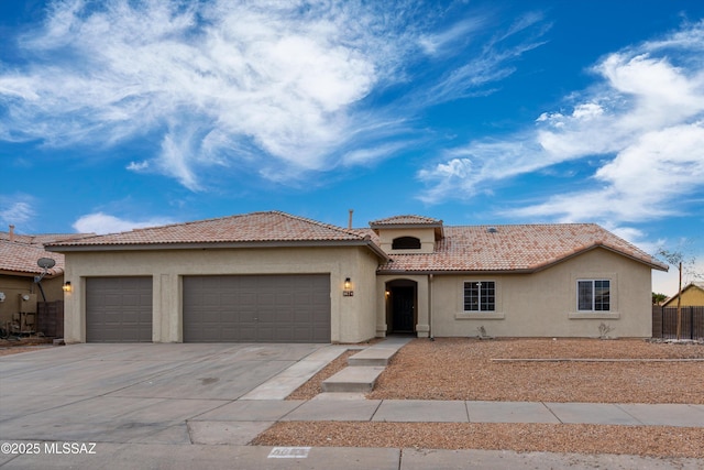 mediterranean / spanish house featuring a garage