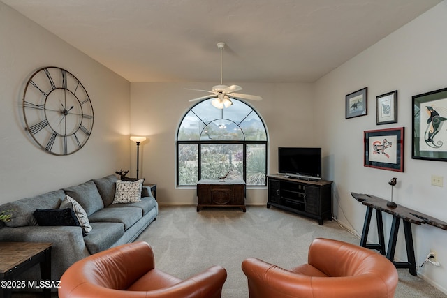 living room featuring light colored carpet and ceiling fan