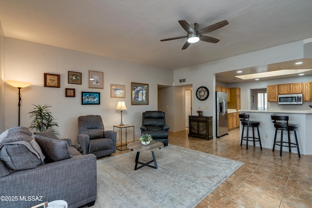 living room featuring ceiling fan