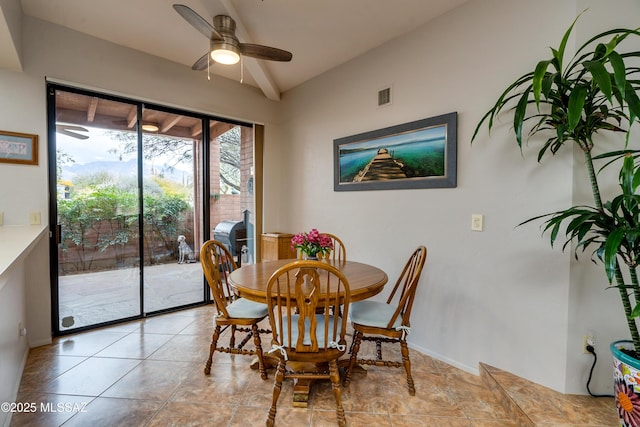 dining area with vaulted ceiling, light tile patterned floors, and ceiling fan