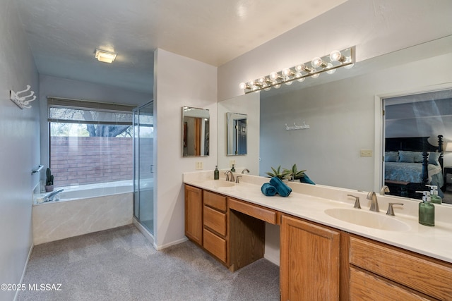 bathroom featuring plus walk in shower and vanity