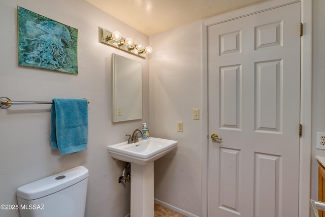 bathroom with sink and toilet