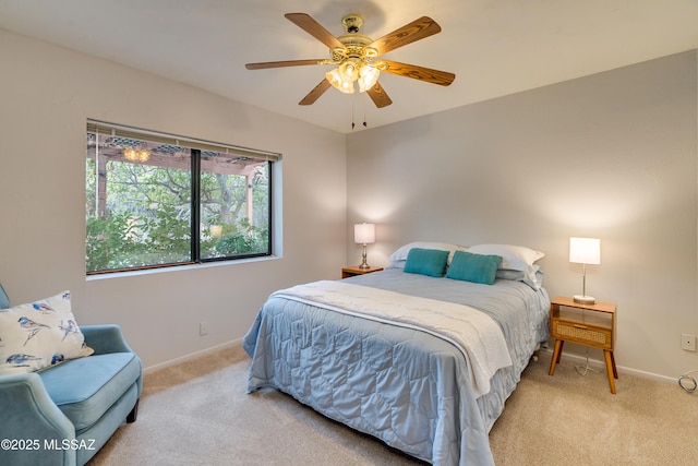 bedroom featuring light carpet and ceiling fan