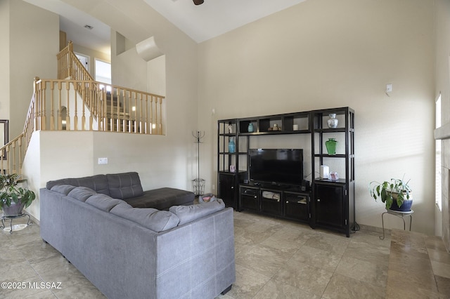 living room with a towering ceiling