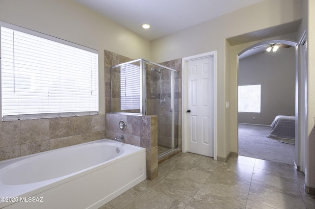 bathroom featuring independent shower and bath, plenty of natural light, and ceiling fan