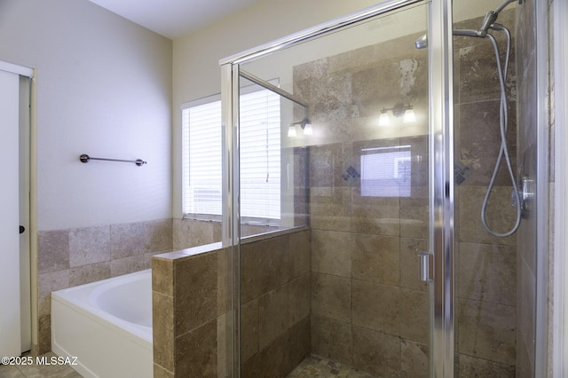 bathroom with tile patterned flooring and independent shower and bath