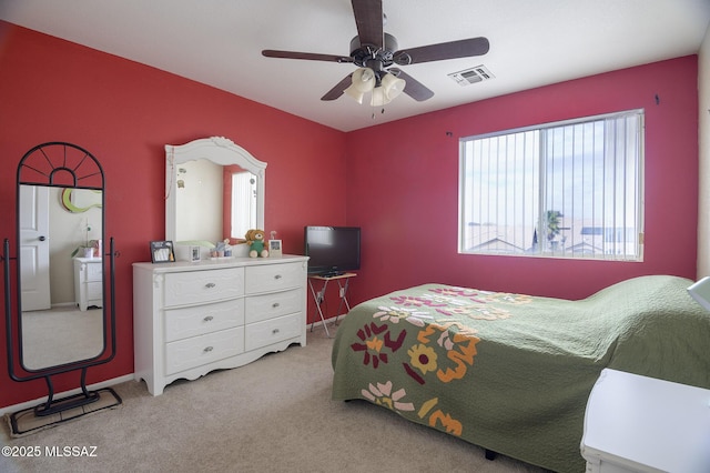 bedroom with ceiling fan and light colored carpet