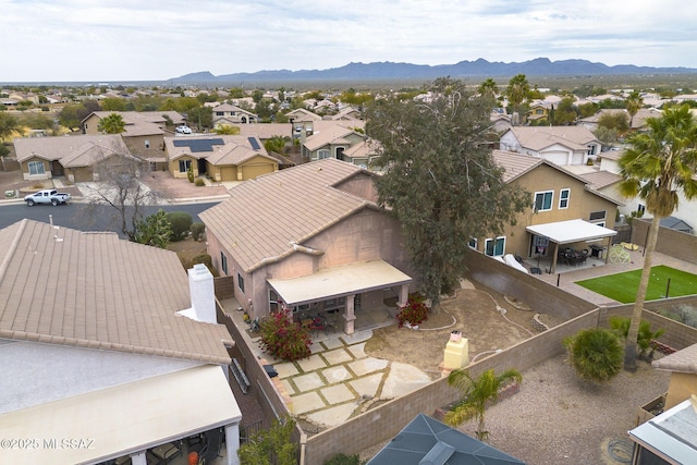 birds eye view of property with a mountain view