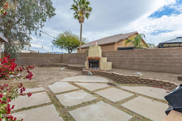 view of patio featuring an outdoor fireplace