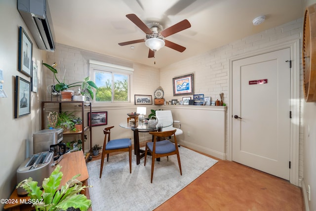 dining area featuring a wall mounted air conditioner, ceiling fan, and brick wall