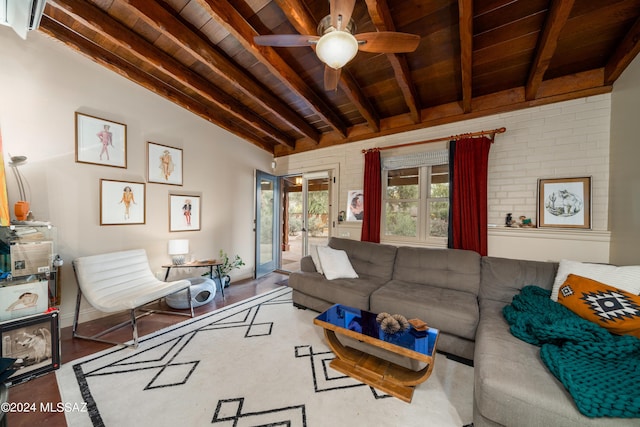 living room with brick wall, beamed ceiling, wood-type flooring, ceiling fan, and wooden ceiling