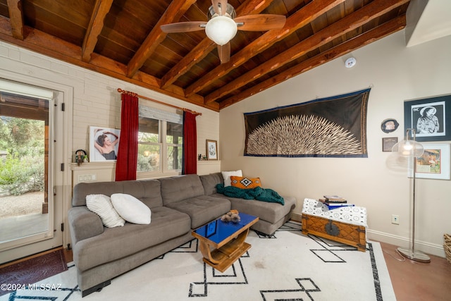 living room featuring ceiling fan, plenty of natural light, lofted ceiling with beams, and wooden ceiling