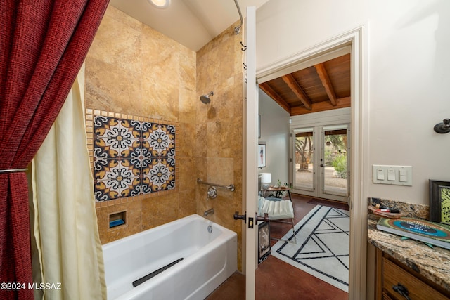 bathroom featuring shower / tub combo, lofted ceiling with beams, and french doors