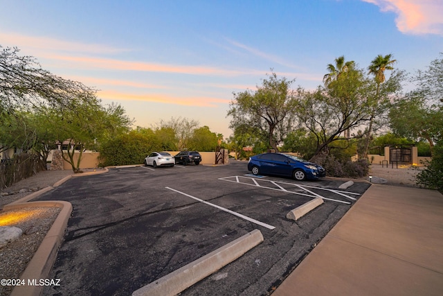 view of parking at dusk