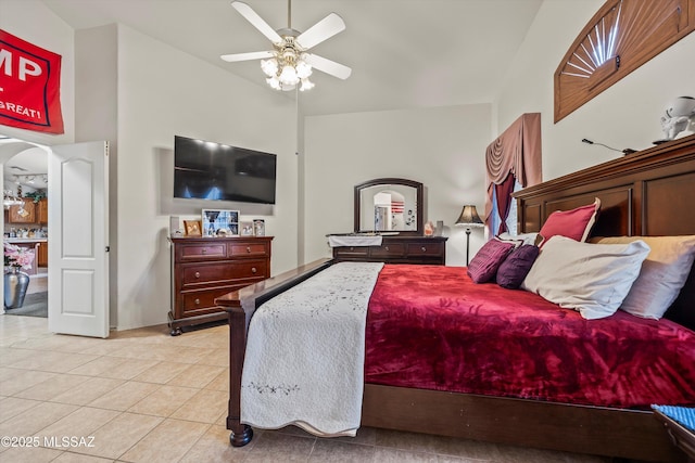 tiled bedroom with ceiling fan