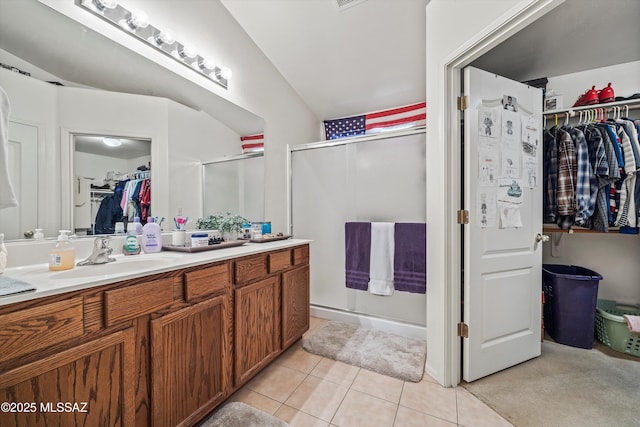 bathroom featuring an enclosed shower, vanity, and tile patterned flooring