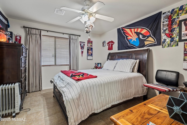 bedroom featuring radiator and ceiling fan