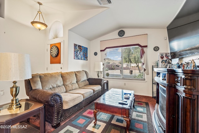 living room with lofted ceiling and dark colored carpet