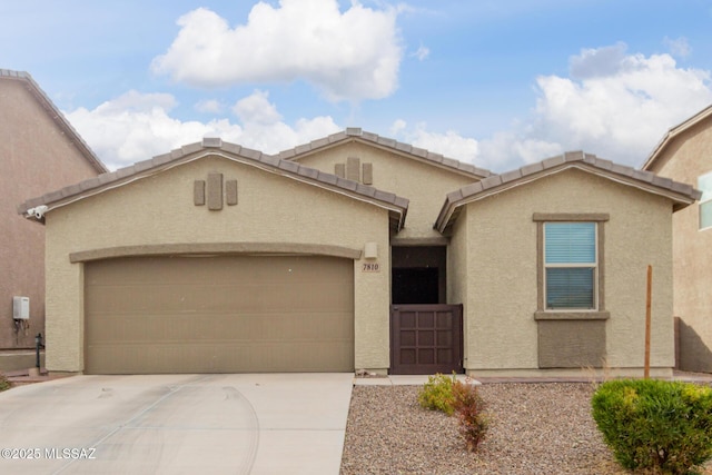 view of front of property with a garage