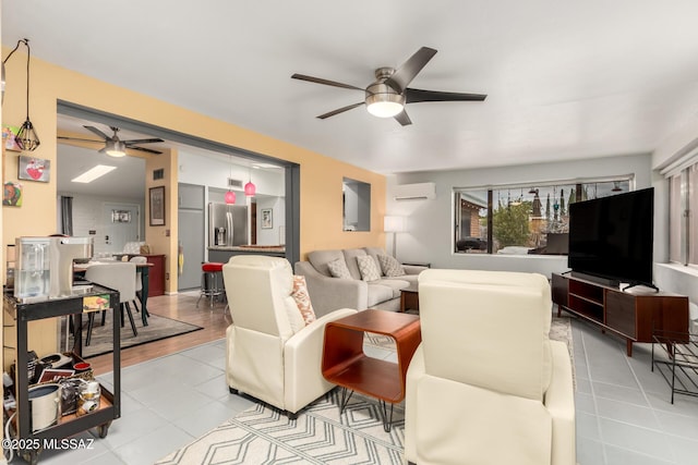 tiled living room with ceiling fan and a wall mounted AC