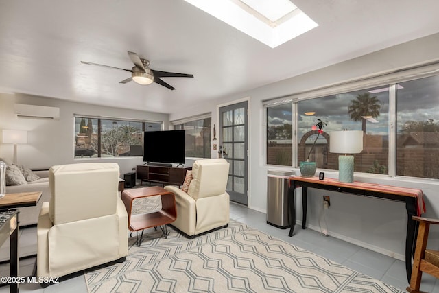 tiled living room featuring an AC wall unit, ceiling fan, and a skylight