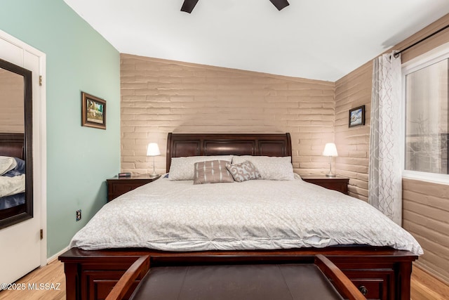 bedroom with ceiling fan and light hardwood / wood-style flooring