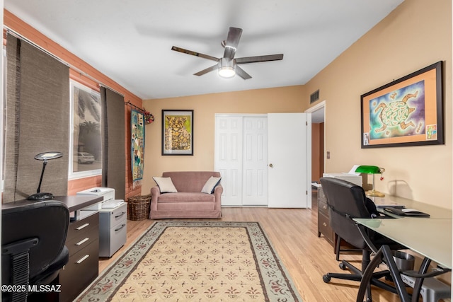 office featuring ceiling fan, lofted ceiling, and light hardwood / wood-style floors