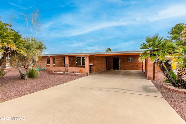 ranch-style home with a carport