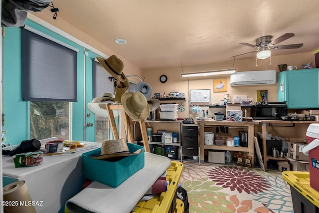 miscellaneous room featuring ceiling fan and a wall unit AC