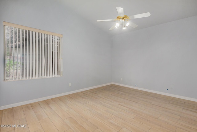 unfurnished room featuring lofted ceiling, ceiling fan, and light hardwood / wood-style flooring