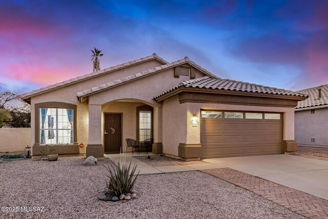 view of front of property featuring a garage