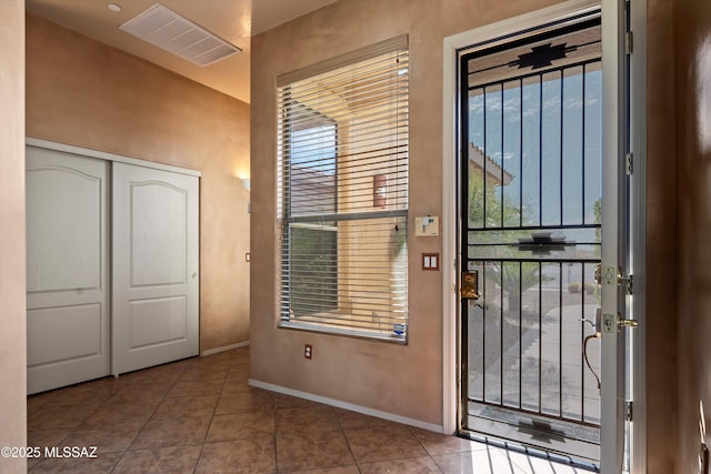 interior space with tile patterned floors and plenty of natural light