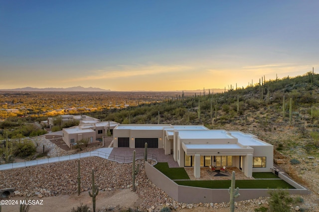 view of front of house with a mountain view and a garage