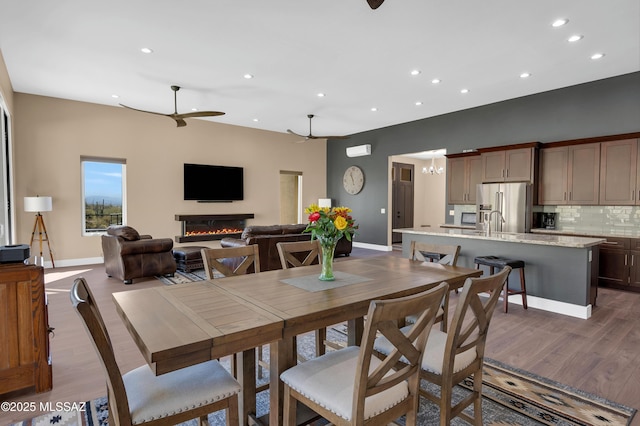 dining space featuring dark hardwood / wood-style floors and ceiling fan