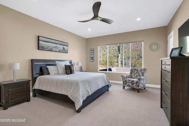 bedroom featuring ceiling fan and light colored carpet