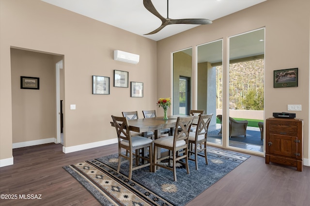 dining room featuring dark wood-type flooring, ceiling fan, and a wall unit AC