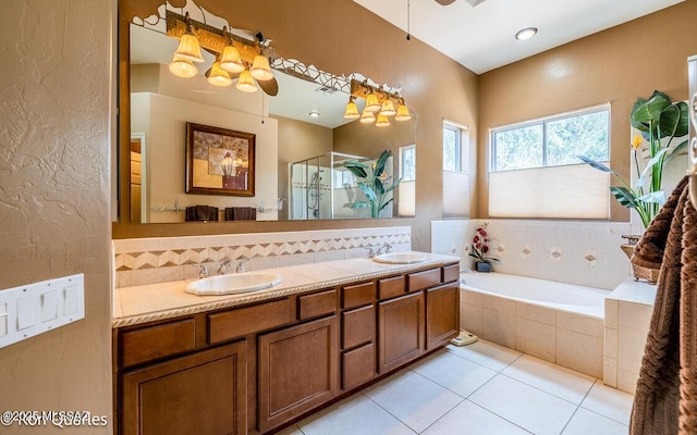 bathroom with vanity, shower with separate bathtub, and tile patterned flooring