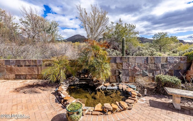 view of patio / terrace featuring a mountain view