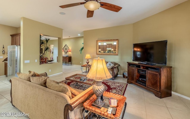 living room with ceiling fan and light tile patterned flooring