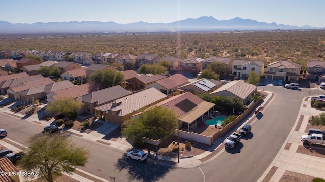 birds eye view of property with a mountain view