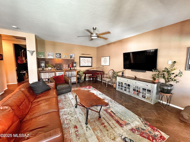 tiled living room featuring ceiling fan and a textured ceiling