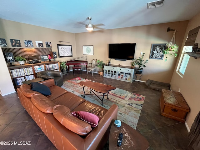 tiled living room with ceiling fan