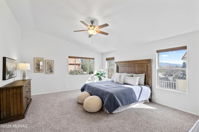 carpeted bedroom featuring vaulted ceiling and ceiling fan