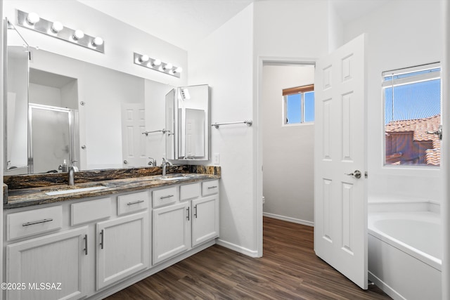 full bathroom with vanity, wood-type flooring, toilet, and separate shower and tub