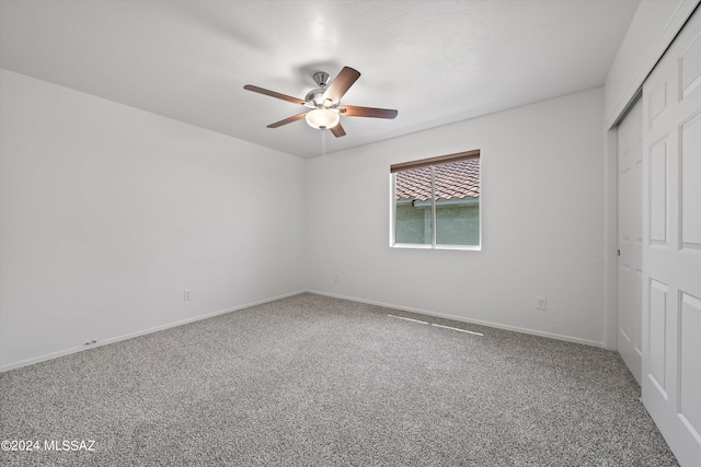 unfurnished bedroom featuring carpet and ceiling fan