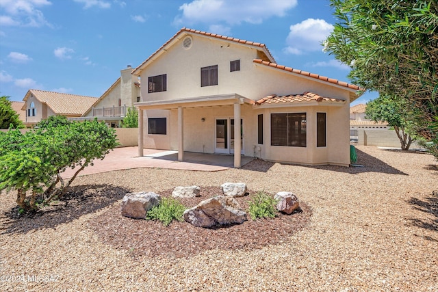 rear view of property featuring a patio area