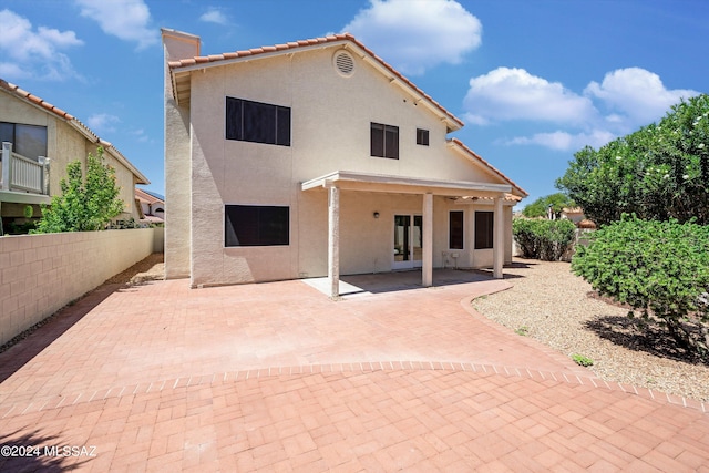 back of property featuring a patio