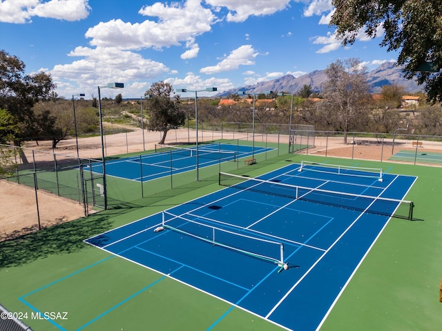 view of sport court with a mountain view