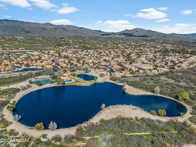 drone / aerial view with a water and mountain view